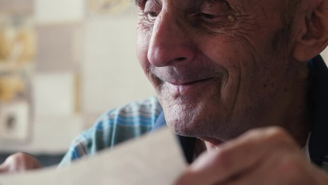 Nostalgia in the lens, a pensioner remembers the past. a Caucasian pensioner and his family memories.