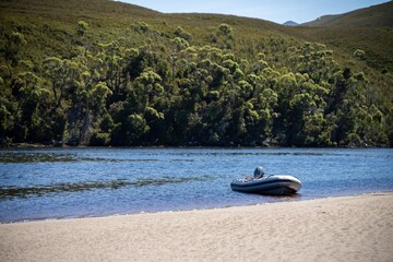 tinny dinghy boat on a river in a national park in the australian bush, On the beach in summer in...