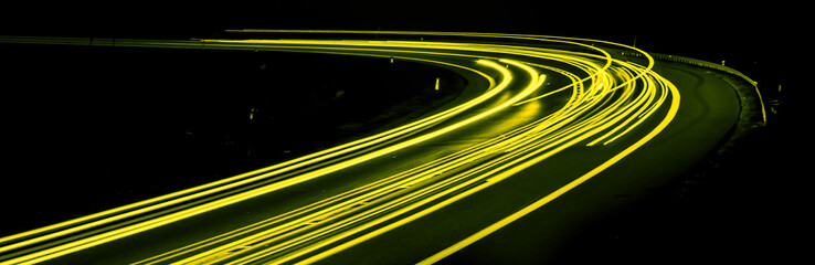 yellow car lights at night. long exposure