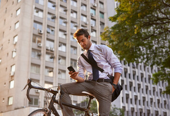 Bicycle, businessman and smartphone for sustainable travel, transportation and communication in...
