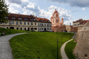Fototapeta na wymiar Vilnius, Lithuania - May 1, 2019 . The Bastion of City Wall, Renaissance-style fortification. Church of the Holy Spirit (Sventosios Dvasios Baznycia)