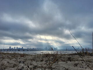 Dnipro river, Dnipro city, Ukraine. Cityscape with sky with clouds and river, and city bridge.