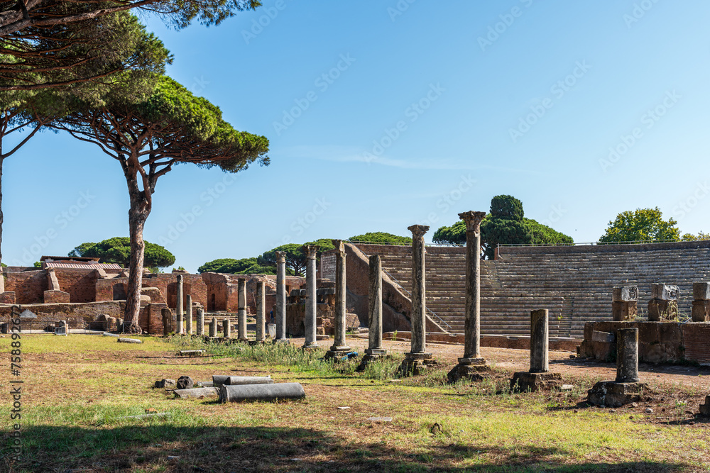 Wall mural Interior view of ancient roman amphitheater in ruins at archaeological park in the italian city of Ostia