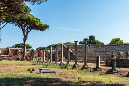 Interior view of ancient roman amphitheater in ruins at archaeological park in the italian city of Ostia