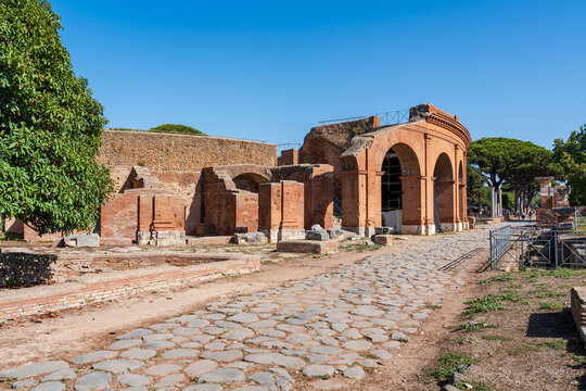 Exterior facade of ancient roman amphitheater in ruins at archaeological park in the italian city of Ostia