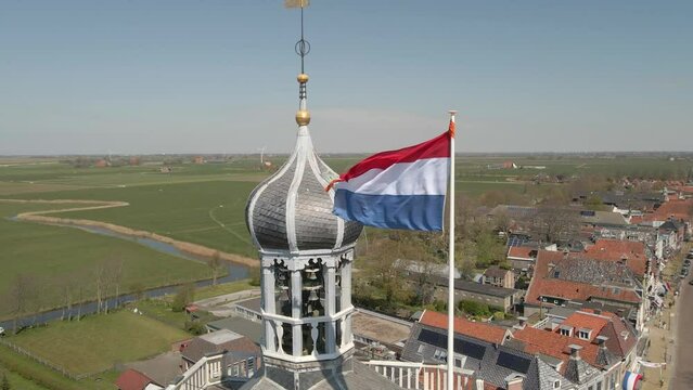 Aerial view of catholic church with dutch flag at kingsday, Workum, Friesland, Netherlands