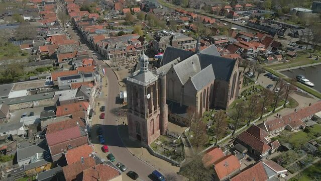 Aerial view of catholic church with dutch flag at kingsday, Workum, Friesland, Netherlands