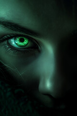 YA fantasy mysterious glowing green eye. Dark skin background contrasting with the bright glowing eye close-up. Gothic fantasy glowing eye. Mystery concept. neon green woman eye