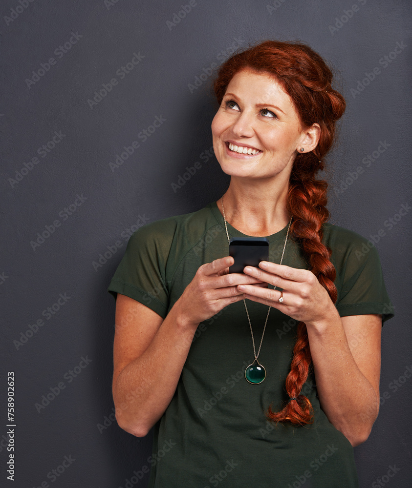Poster smile, thinking and woman in studio with phone for social media, online chat and networking. communi