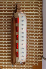 white and red wall with sign
