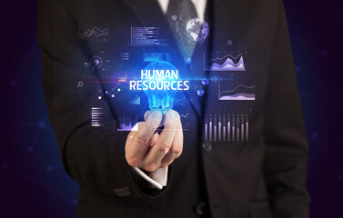 Businessman holding a light bulb, new business concept