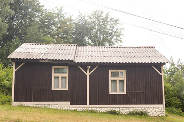 old wooden house in spring Carpathian mountains in Ukraine