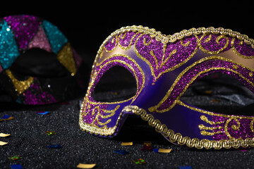 Venetian Masquerade masks on black background. Carnival party layout.