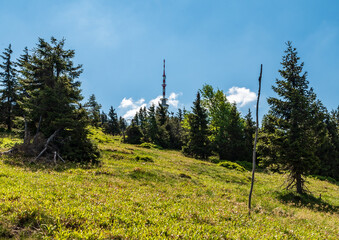 Communication tower on Praded hill from hiking trail near Svycarna hut in Jeseniky mountains