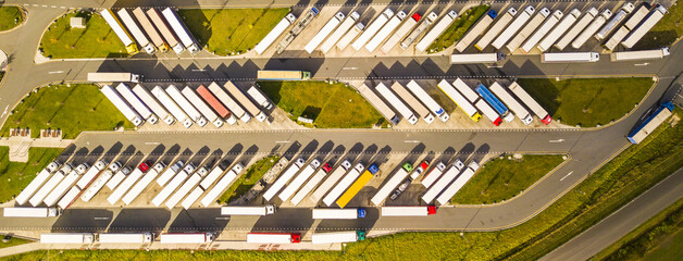 Truck parking lot on the highway. Aerial view of rest area on road infrastructure.