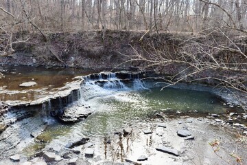 The waterfall in the forest on a sunny day.