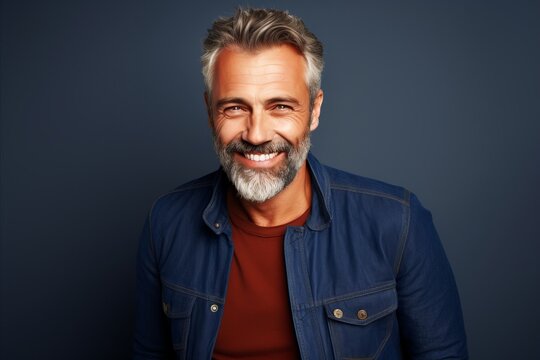 Handsome middle-aged man with gray hair and beard.
