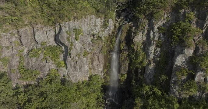 Aerial view of lush green forest with breathtaking waterfall, Piton de la Petite Riviere Noire, Mauritius.