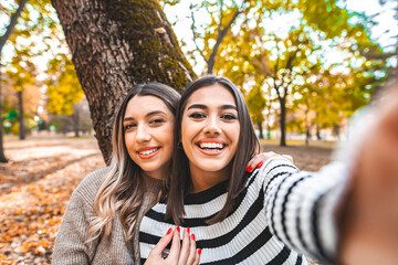 Two Women Taking a Selfie in a Park