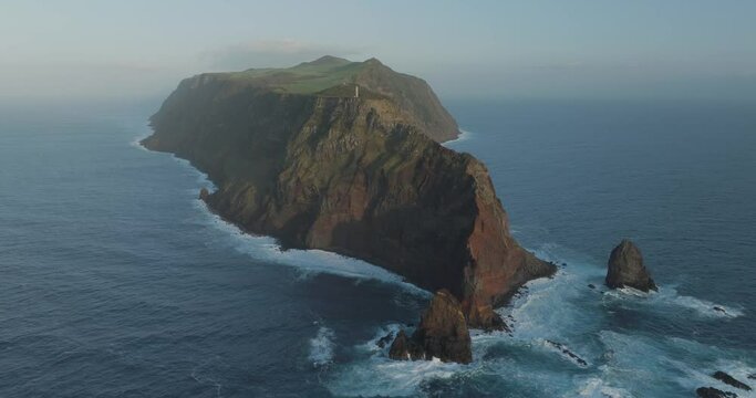 Aerial view of Sao Jorge Island with Farol dos Rosais lighthouse and beautiful coastline, Azores, Portugal.
