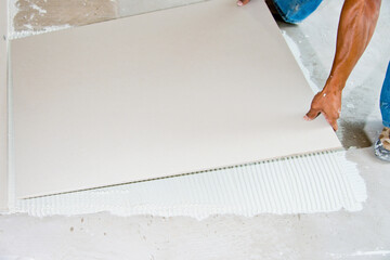Laying of 1 x 1 meter porcelain tile floor, Brasilia, Brazil, Nov 2020