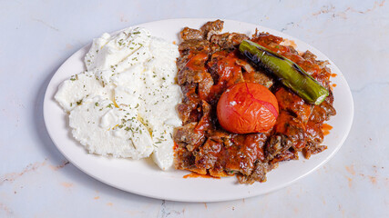 Iskender doner kebab with yogurt on plate
