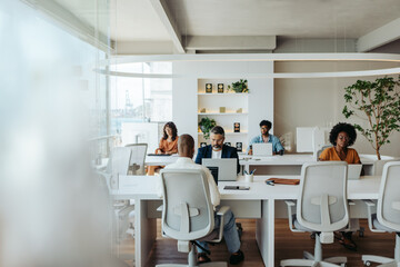 Multicultural colleagues working together in a creative coworking office