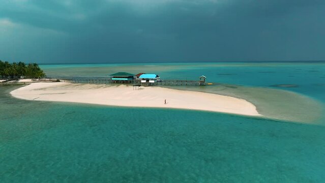 Aerial view of Onok Island beach with pristine turquoise waters, Balabac, Palawan, Philippines.