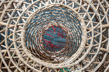 A big wicker fishing basket on the fishermen's bench in the port of Mar del Plata, Argentina.