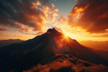 Beautiful sunset over a mountain with lush green grass, suitable for nature and landscape...