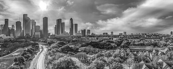 Aerial monochrome view of the Houston Texas Downtown cityscape with tall skyscrapers in early morning during winter.