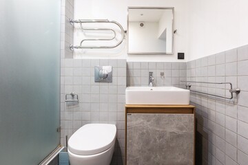 modern bathroom room with toilet and washing machine