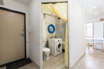 modern bathroom room with toilet and washing machine