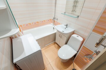 modern bathroom room with toilet and washing machine