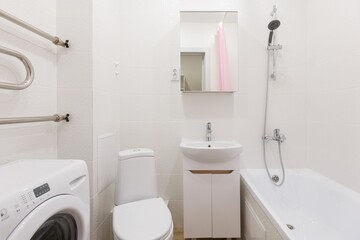 modern bathroom room with toilet and washing machine