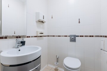 modern bathroom room with toilet and washing machine