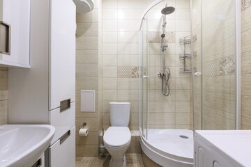 modern bathroom room with toilet and washing machine