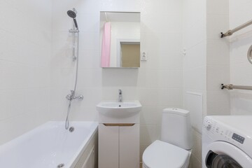 modern bathroom room with toilet and washing machine