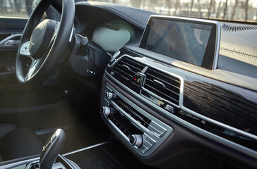 Shift lever, car steering wheel and sensors. Inside a modern car view, city car interior background