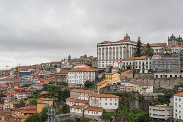 Fototapeta na wymiar The buildings of Porto city, Portugal, with Porto Cathedral overlooking it all. The city is famous for the export of Port, a fortified wine