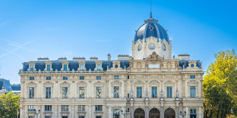 Front facade of the Commercial Court building along the Seine river in Paris, France