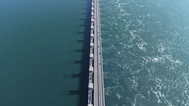 Aerial drone view of storm surge barrier Oosterscheldekering, bridge and water barrier, The Netherlands
