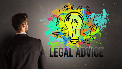 businessman drawing colorful light bulb