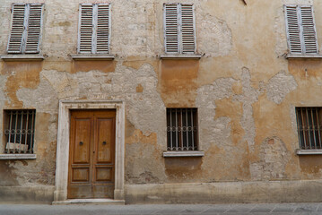 Fototapeta premium Glimpse of the town of San Quirico d'Orcia, Tuscany, Italy