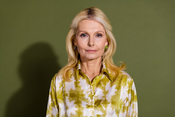 Photo of adorable gorgeous woman dressed printed clothes isolated on khaki color background