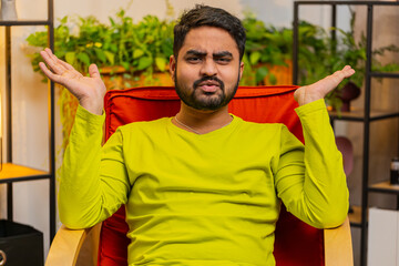 What. Why. Frustrated Indian man raising hands in indignant expression, asking reason of failure,...