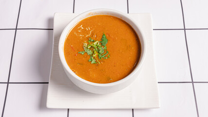 Lentil soup bowl isolated top view