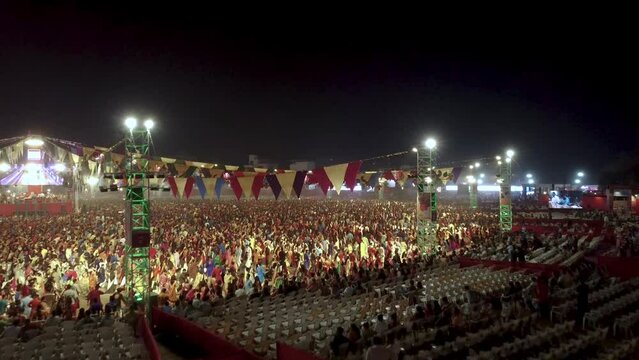  Aerial view of Navratri Festival dancing traditional Garba dance with classic indian dresses in Gujarat. Indian culture and Hindu festival