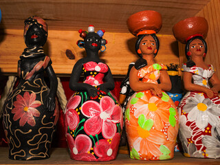 Clay and colorful dolls, typical of northeastern Brazil, are souvenirs for sale to tourists at the Central Market in Fortaleza, Ceará. - obrazy, fototapety, plakaty