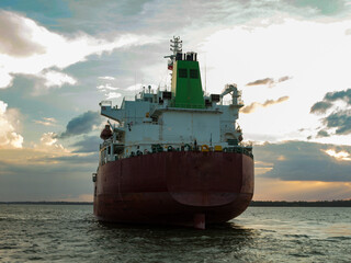 The stern of a merchant ship parked in Marajó Bay, in the state of Pará, Brazil. Export logistic...